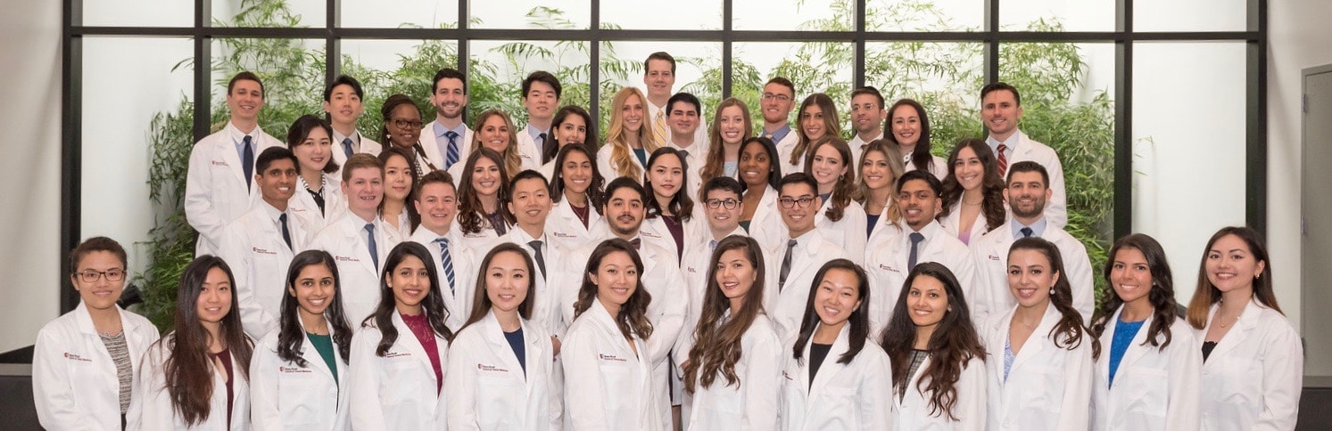 how to get into dental school image of white coat ceremony